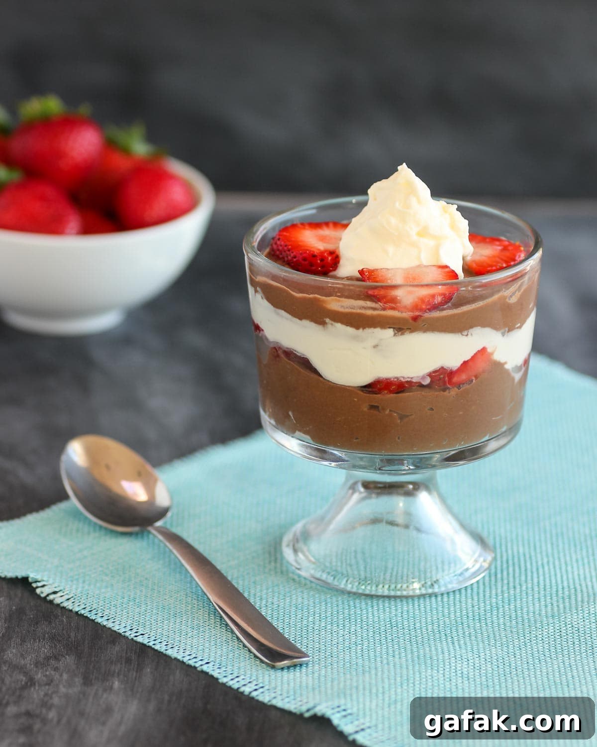 Paleo Chocolate-Strawberry Parfait Recipe for Clean Eating 2 A creamy chocolate pudding with whipped cream and sliced strawberry parfait.