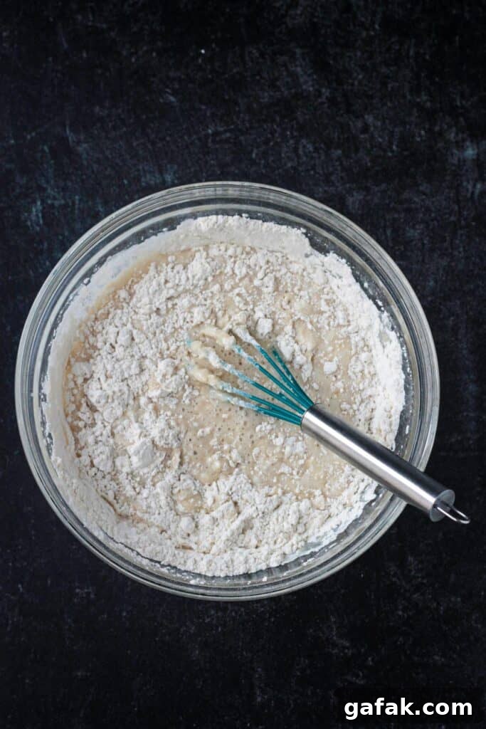 Dry ingredients starting to incorporate into the wet.