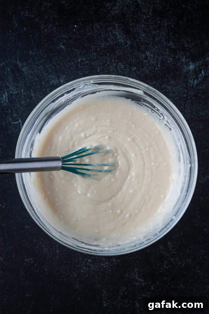 Wet and dry ingredients whisked together in a bowl until smooth.
