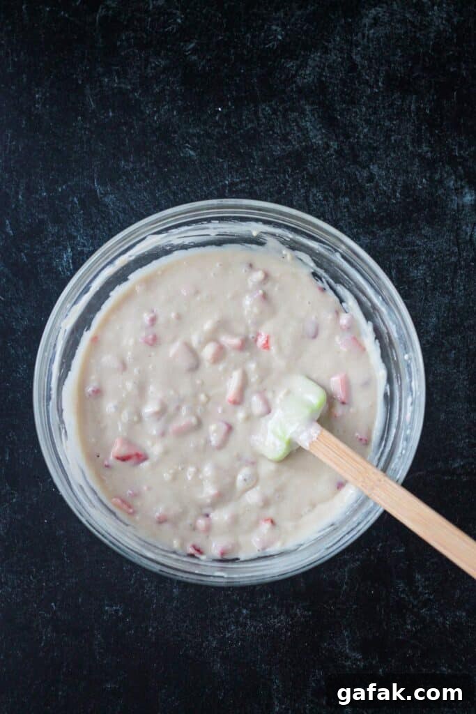 Strawberries mixed into the batter evenly.