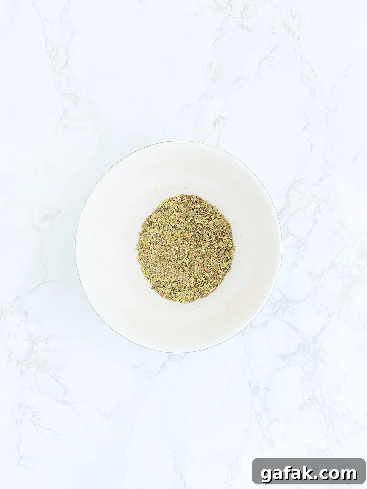 Seasoning ingredients mixed up in a small mixing bowl.