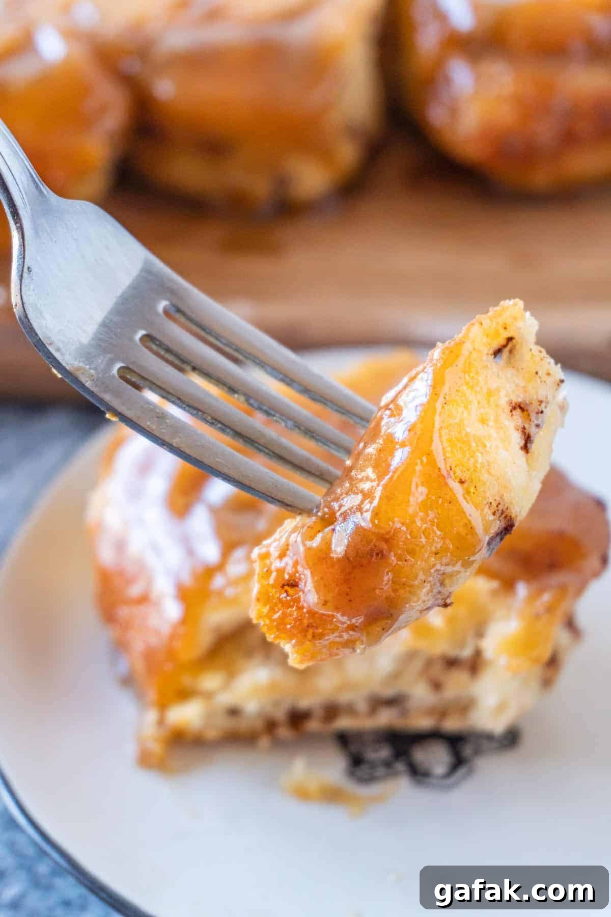 Piece of sticky bun on fork