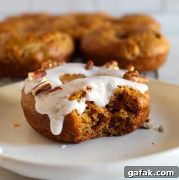 bite of a gluten free carrot cake donut