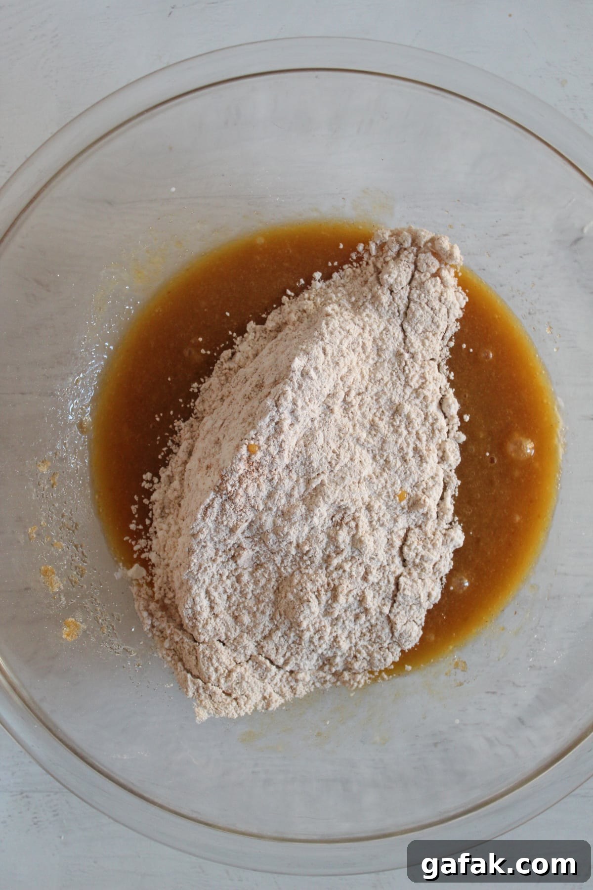 adding the dry ingredients to the wet ingredients