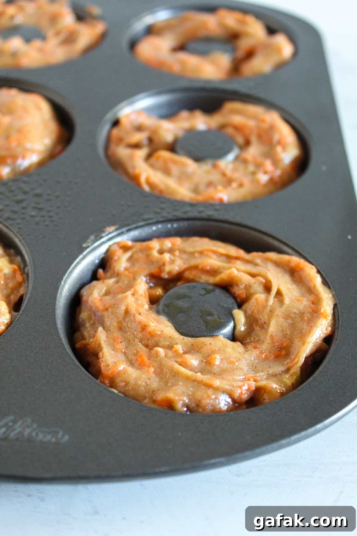 donut batter in a baking pan