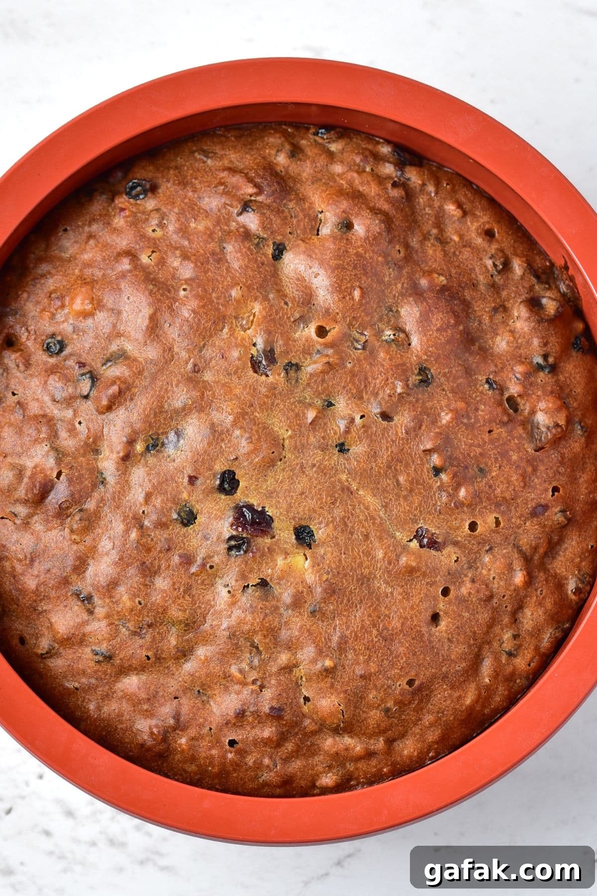 Gluten Dairy-Free Fruit Cake Freshly baked fruit cake in cake pan
