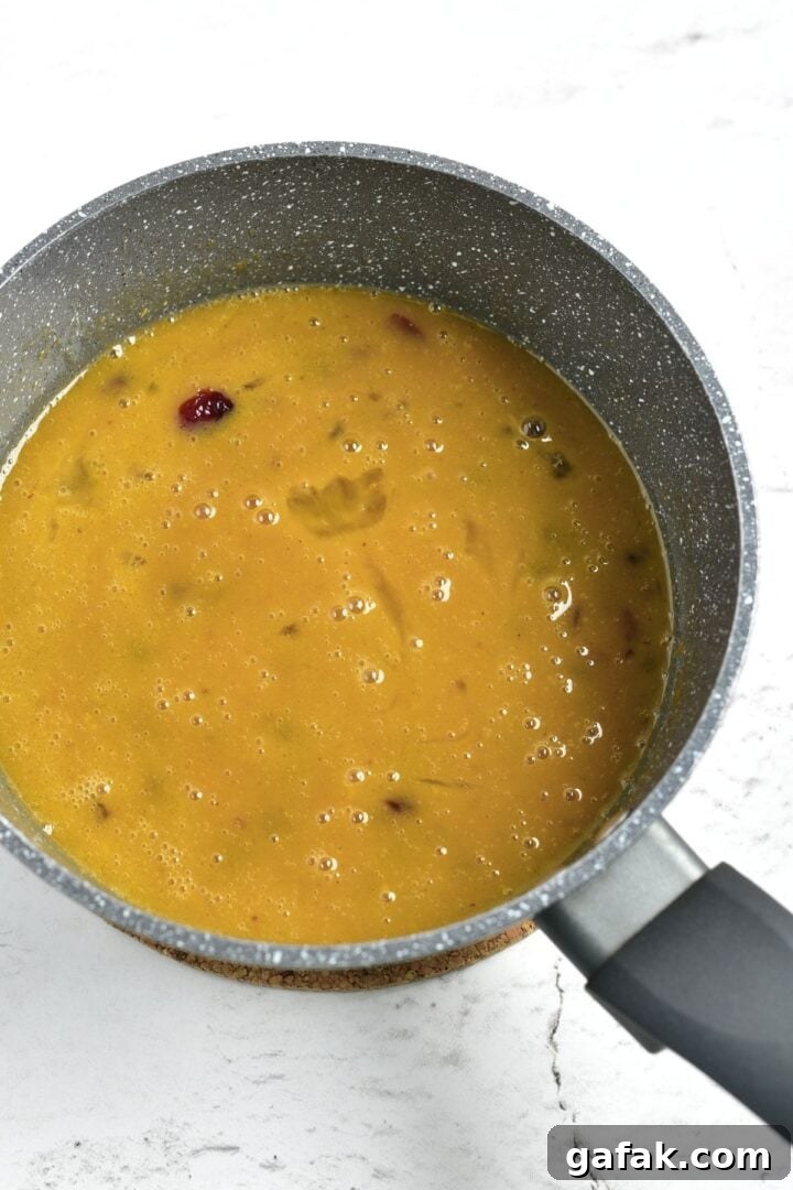 Gluten Dairy-Free Fruitcake Batter Fruitcake batter in saucepan