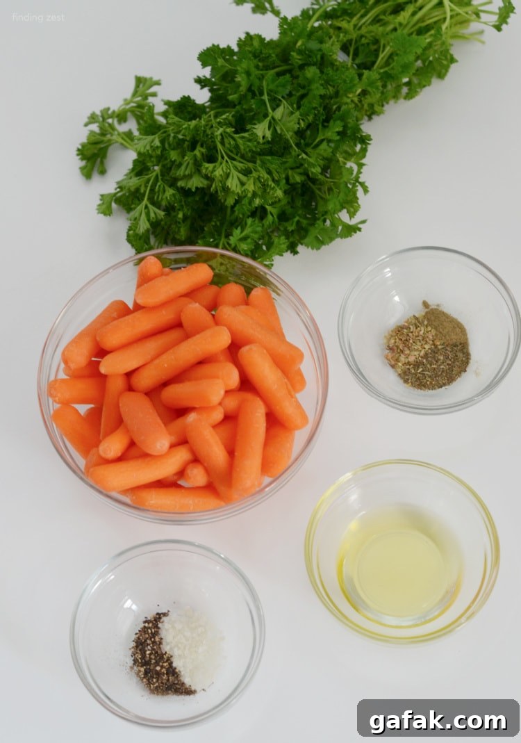 Crispy Air Fryer Baby Carrots Recipe for Quick Side Dish 4 Ingredients needed for air fryer baby carrots recipe including dried herbs, fresh parsley and olive oil.