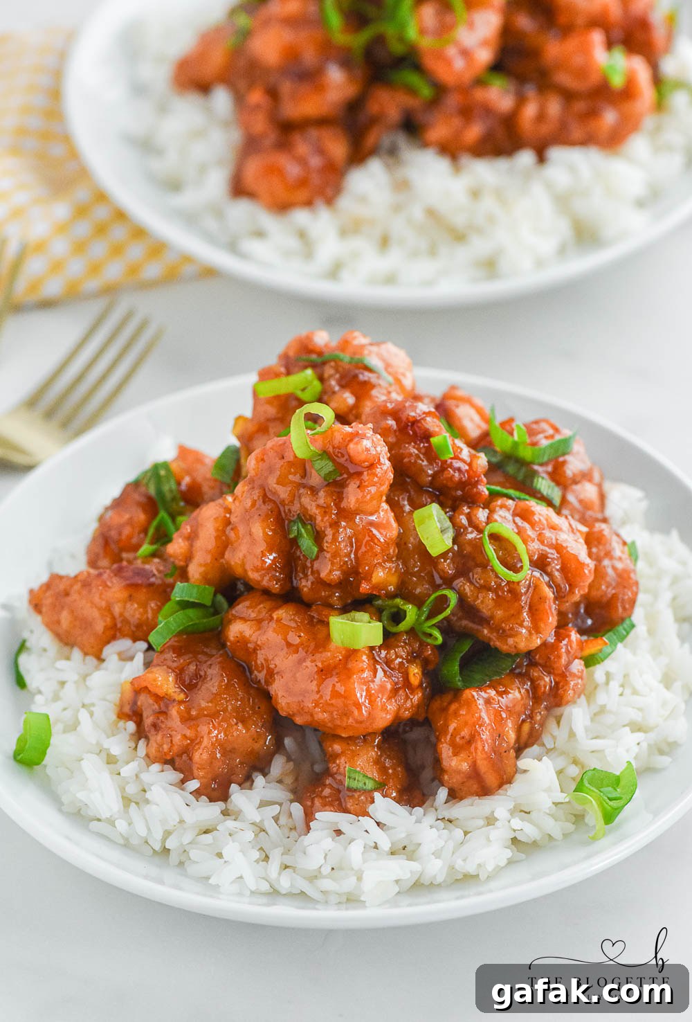 Crispy Orange Chicken Recipe with Tangy Mandarin Sauce 2 Orange Chicken that's made with 4 ingredients! Yummy bites of chicken covered in a sweet and flavorful orange sauce. 30-minute dinner recipe!