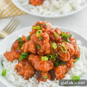 Crispy Orange Chicken Recipe with Tangy Mandarin Sauce 10 Orange Chicken that's made with 4 ingredients! Yummy bites of chicken covered in a sweet and flavorful orange sauce. 30-minute dinner recipe!