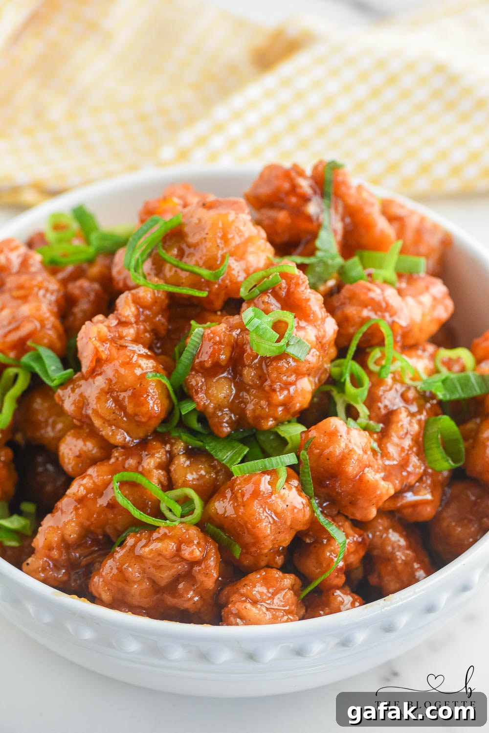 Crispy Orange Chicken Recipe with Tangy Mandarin Sauce 3 Orange Chicken that's made with 4 ingredients! Yummy bites of chicken covered in a sweet and flavorful orange sauce. 30-minute dinner recipe!