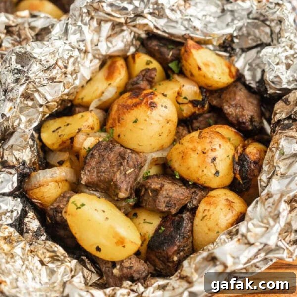 Chipotle Steak Recipe: Smoky Grilled Steak with Chili-Lime Rub 13 Grilled steak and potatoes in foil.