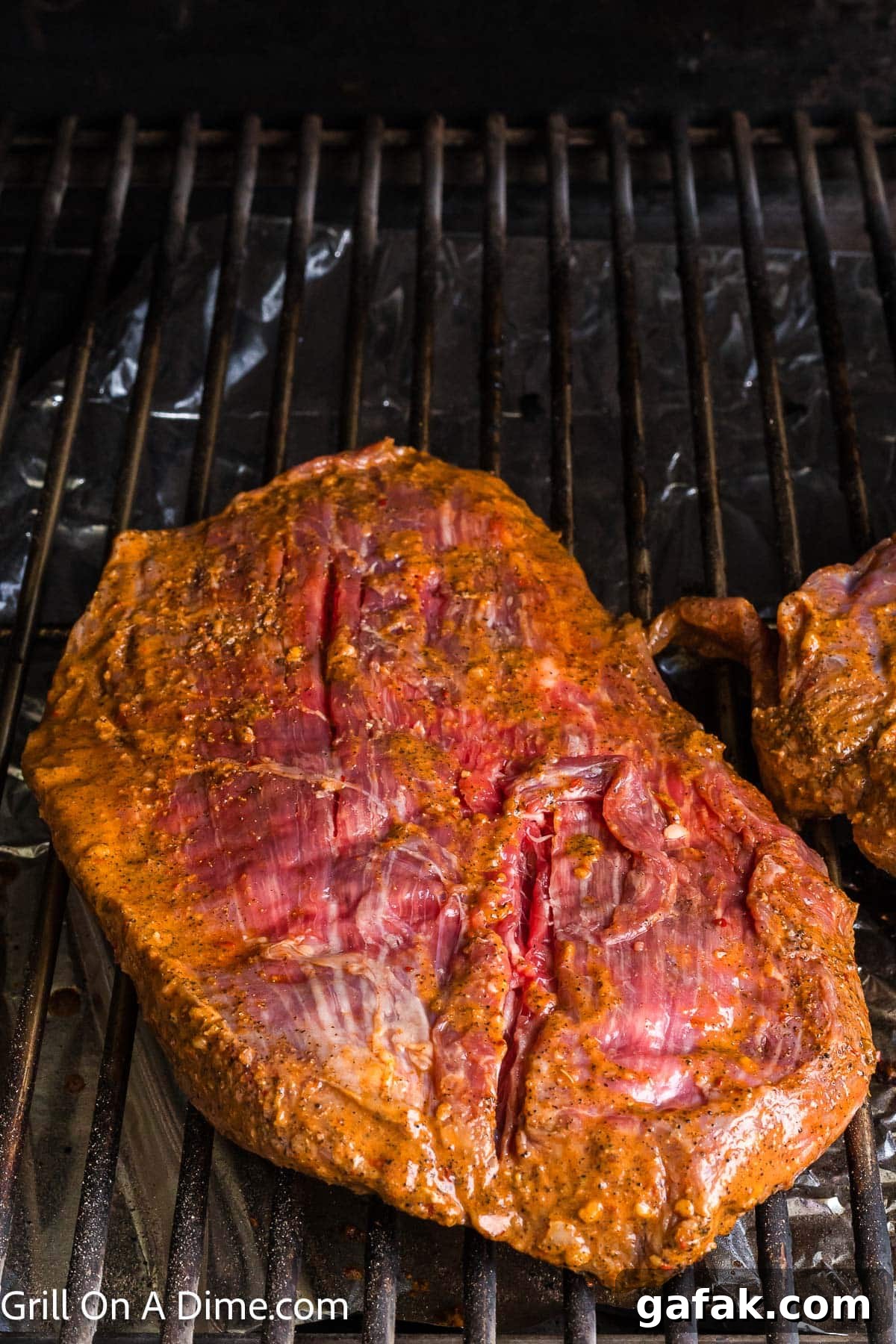 Chipotle Steak Recipe: Smoky Grilled Steak with Chili-Lime Rub 6 Placing marinated steak on the grill