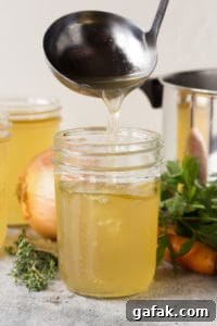 ladling stock into mason jars