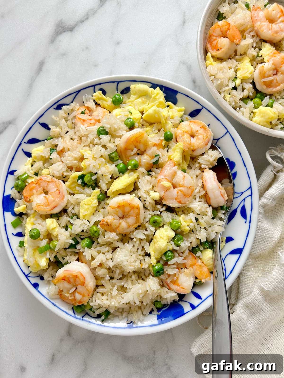 fried rice in ceramic bowl with spoon