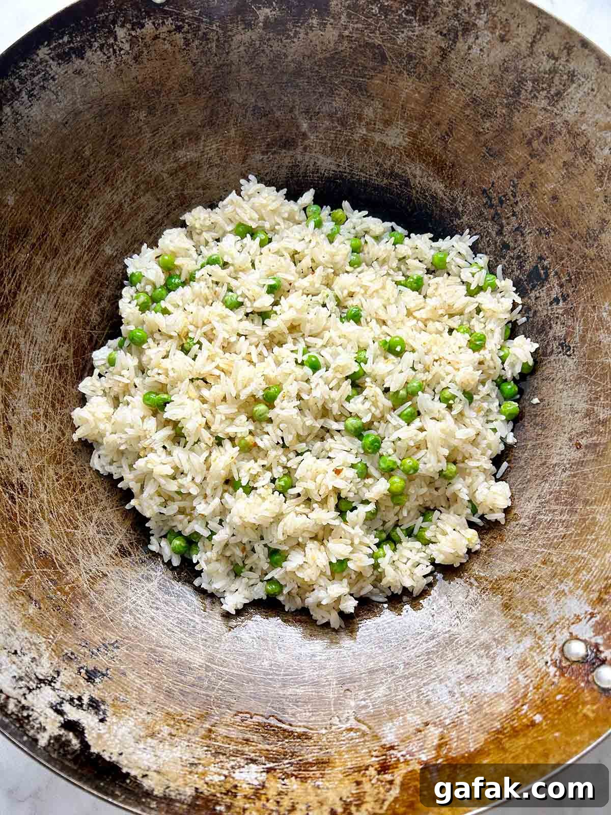 frying rice in wok