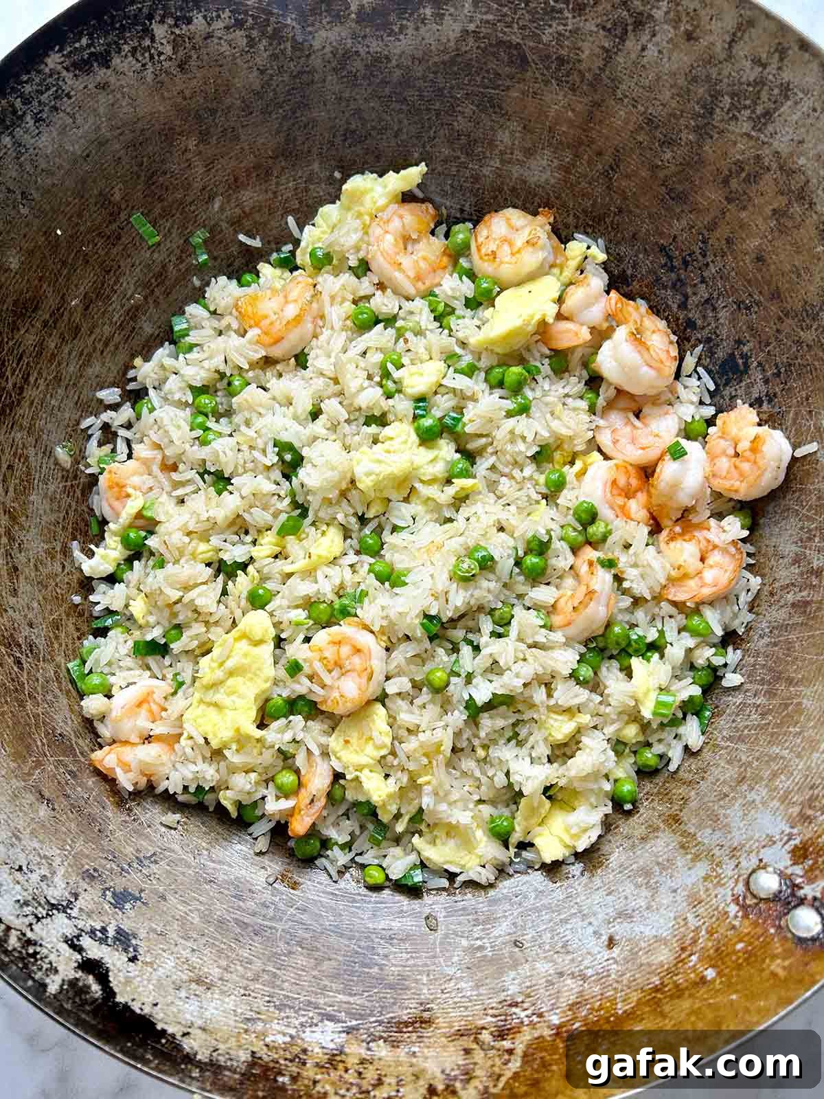 frying all ingredients in wok