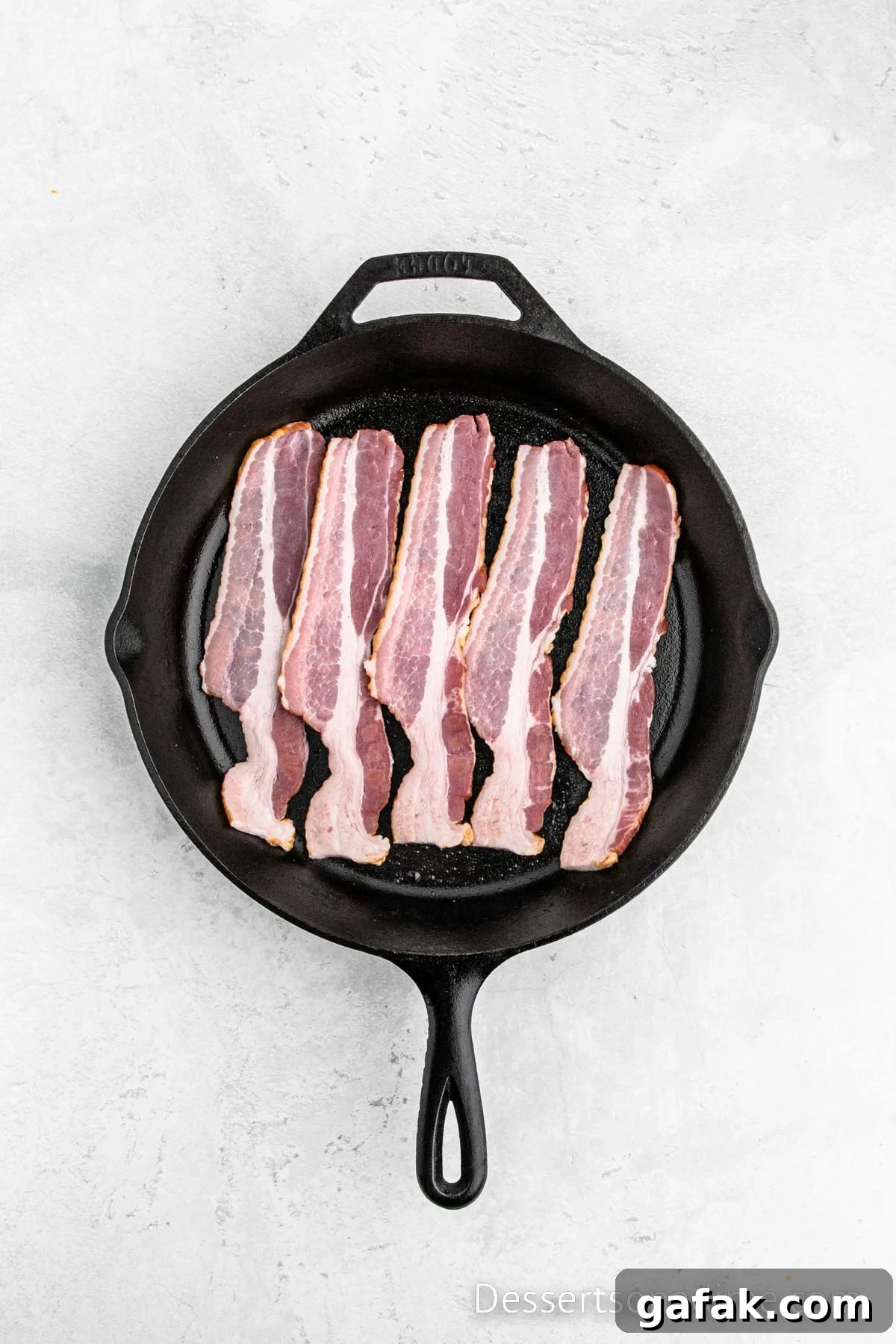 Skillet with bacon slices. 