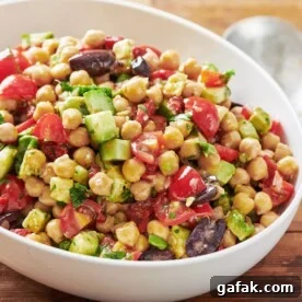 White bowl of chickpea salad.