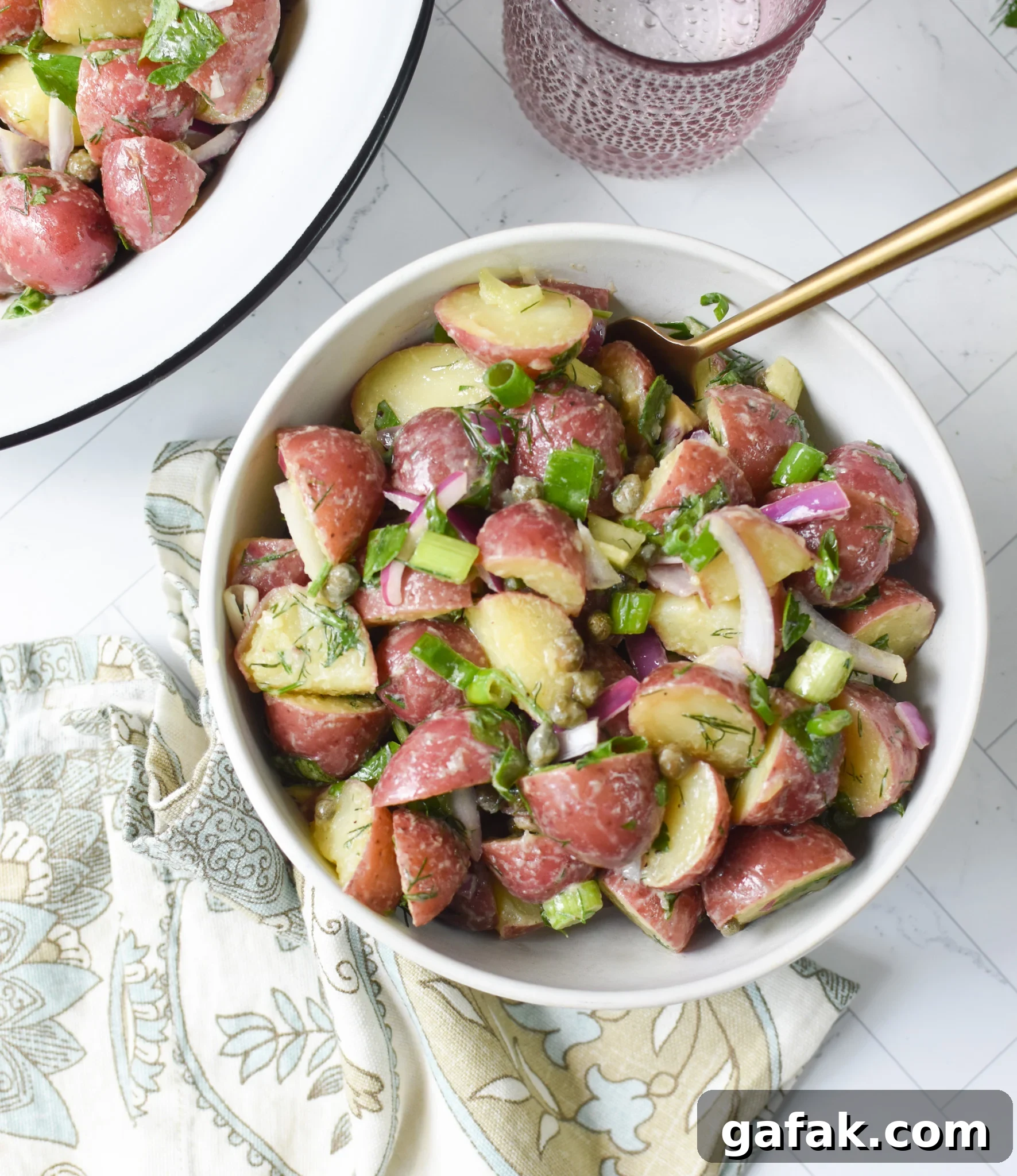No Mayo Potato Salad in a small white bowl.