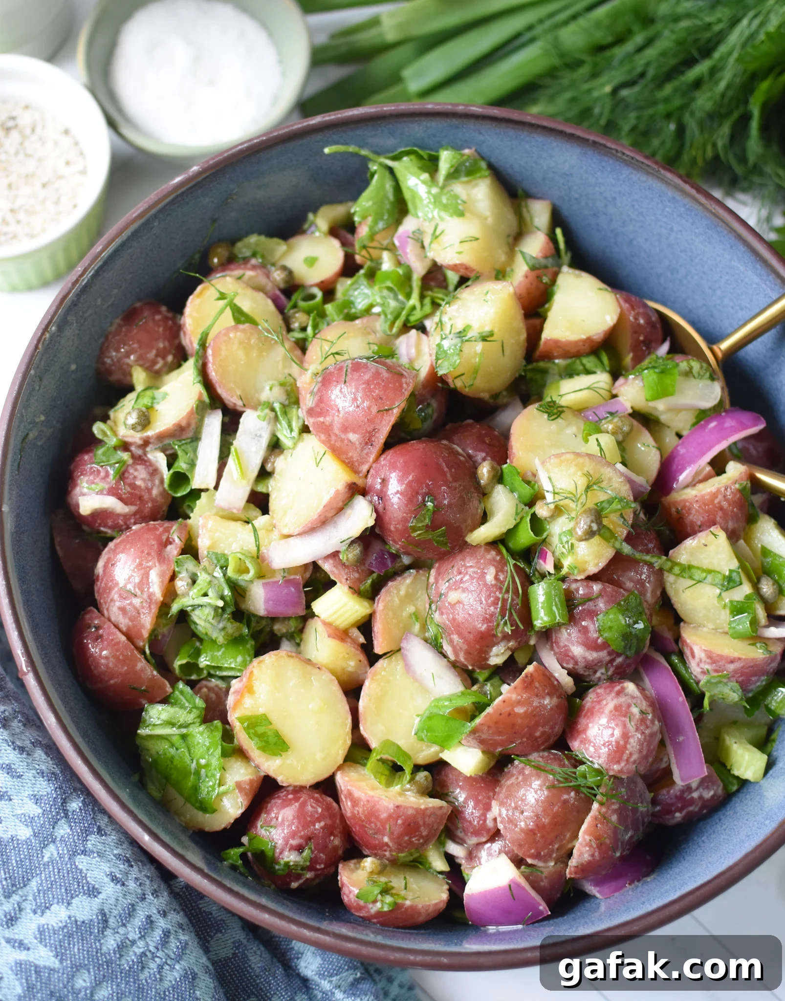 No Mayo Potato Salad in a blue bowl.
