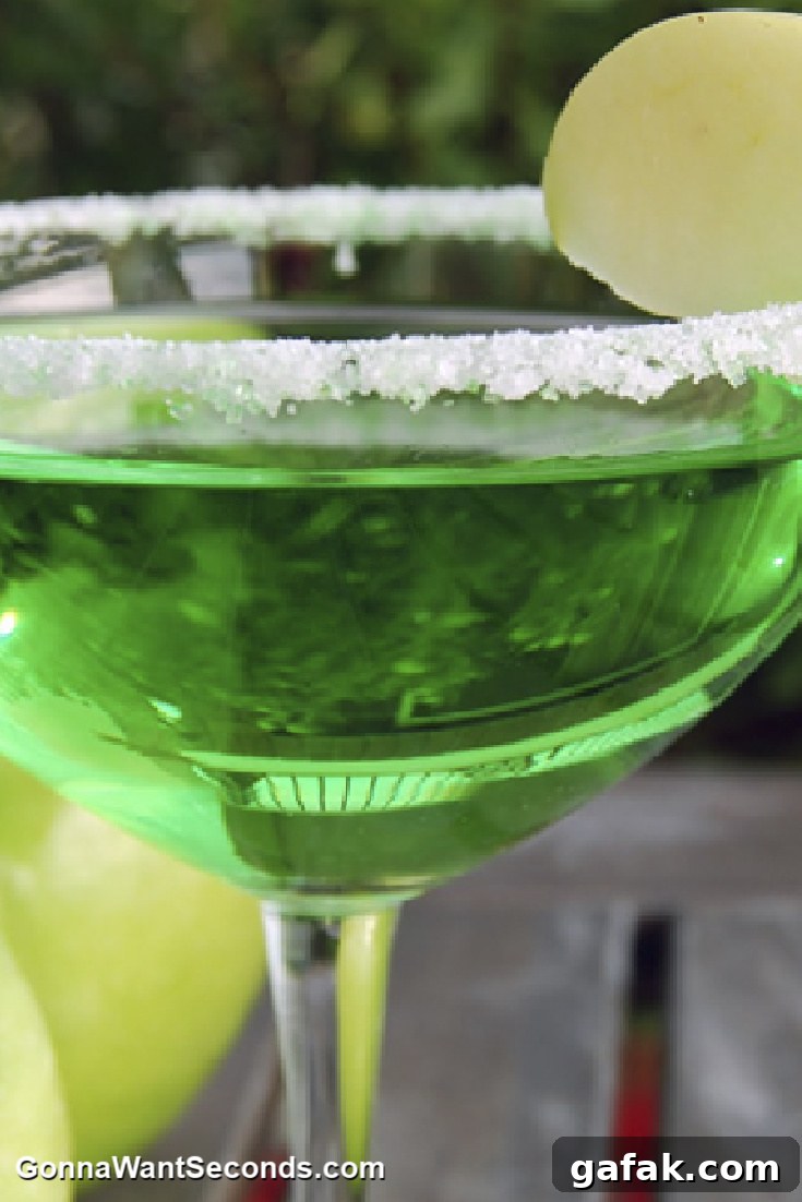 green apple martini in a martini glass