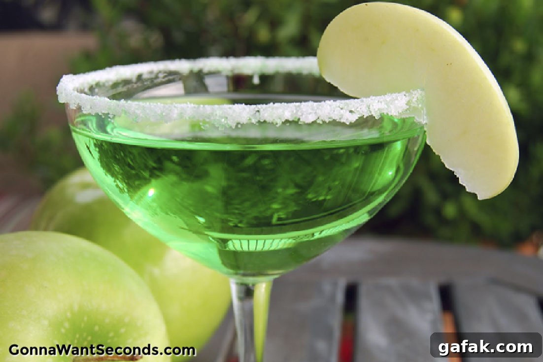 green apple martini in a martini glass
