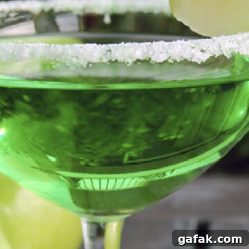 green apple martini in a martini glass