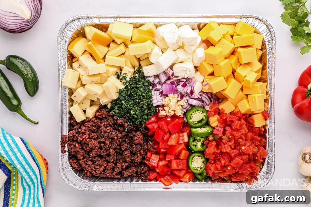 ingredients for Smoked Queso Dip in foil pan