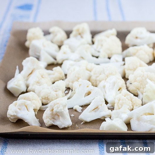 Amazing Cauliflower Poppers; Cauliflower Pieces on a Baking Sheet | Low-Carb, So Simple