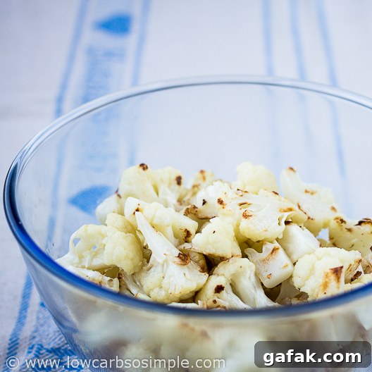 Amazing Cauliflower Poppers; Prebaked Cauliflower Added to the Bowl with the Breading Mixture | Low-Carb, So Simple
