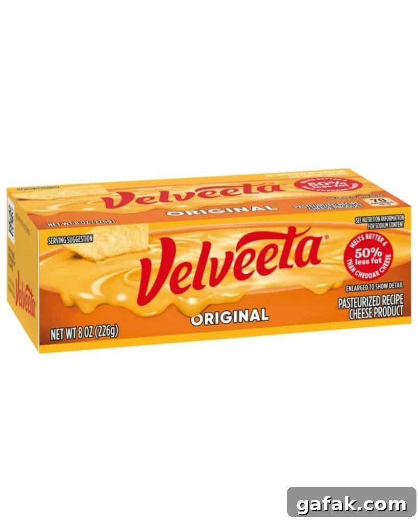 A box of Velveeta cheese on a white background.
