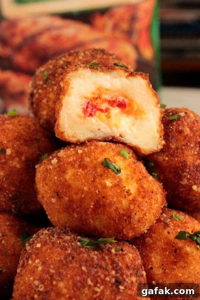 Cooked Perfect Premium Fire Grilled Chicken Zesty Herb and Spices Wings with Pimento Cheese Stuffed Fried Mashed Potato Bites