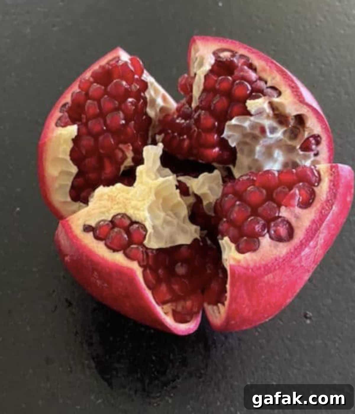 Pomegranate pulled open.