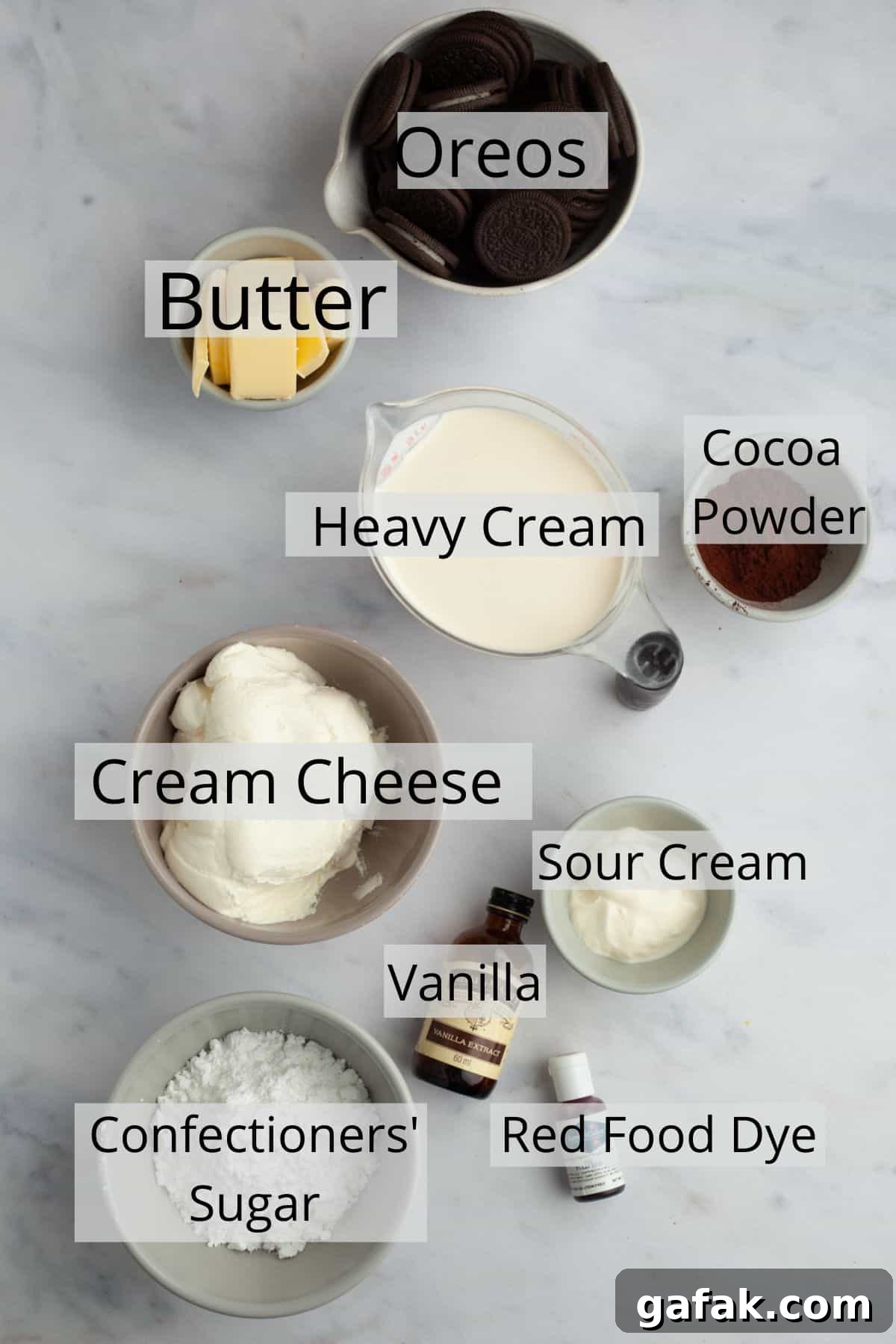 All the ingredients for red velvet oreo cheesecake weighed out into small bowls.