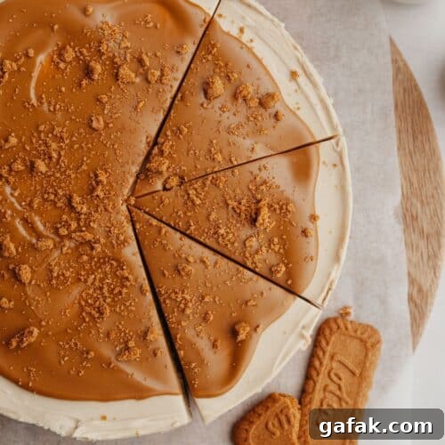 A biscoff cheesecake with 3 slices cut.