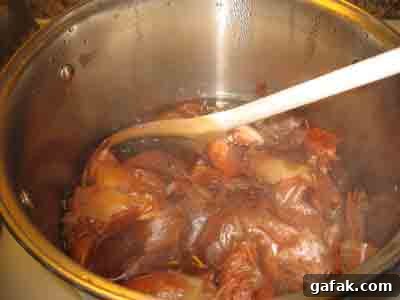 Boiling onion skins to make natural easter egg dye.