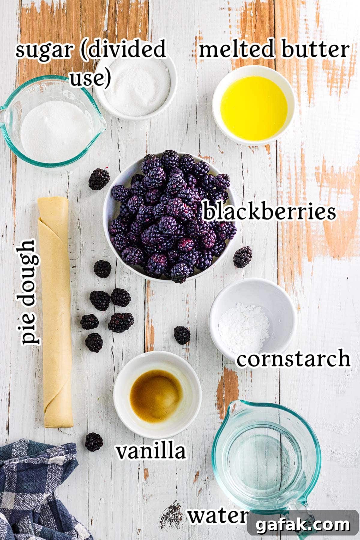 Labeled ingredients for blackberry cobbler with pie crust.