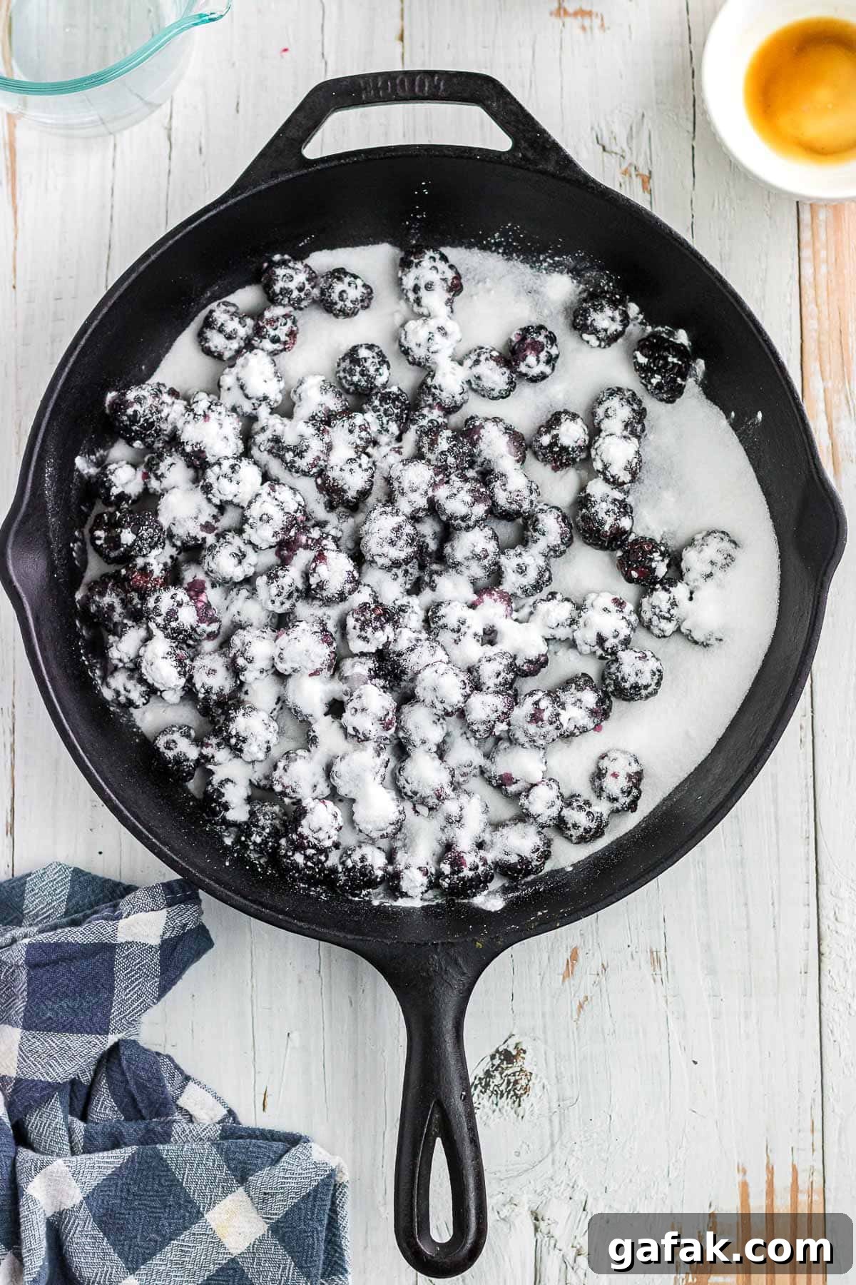 The blackberries, sugar, and starch combined in a skillet.