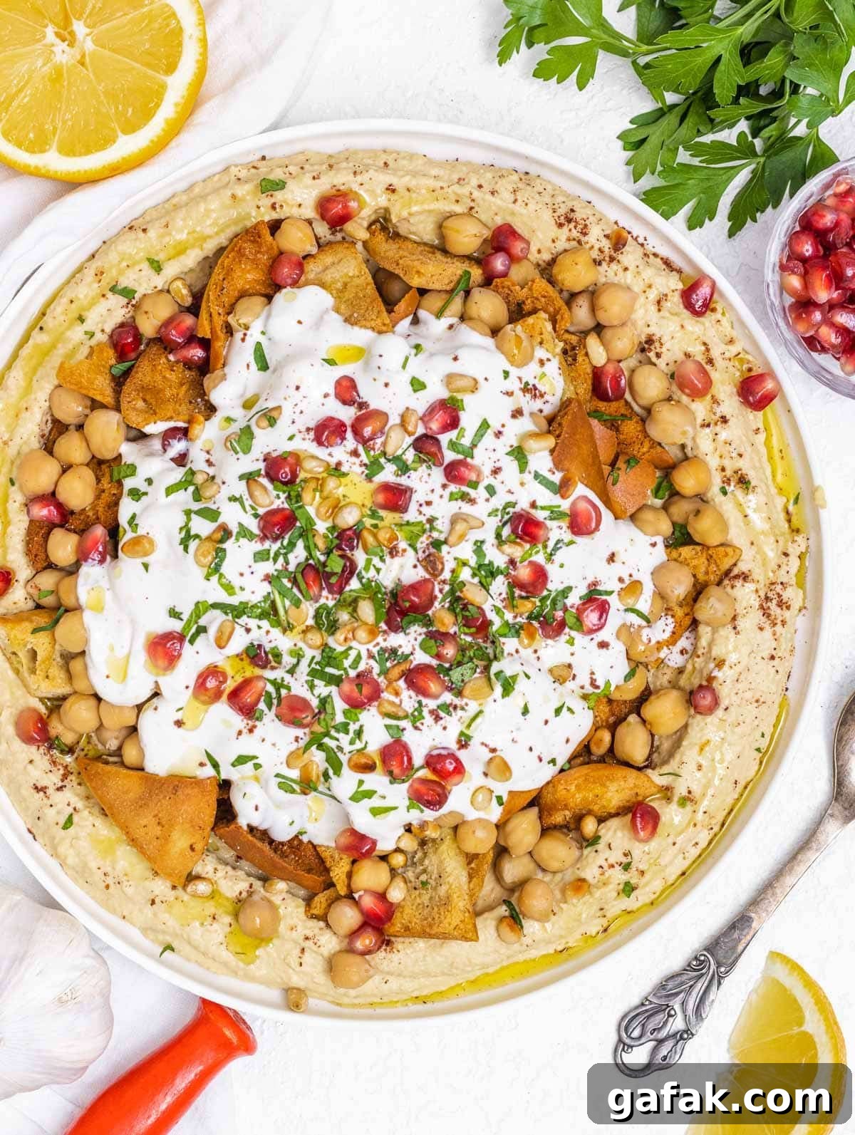 Fatteh with Pita, Hummus, and Creamy Yogurt Bowl 2 Fatteh hummus with pomegranate seeds