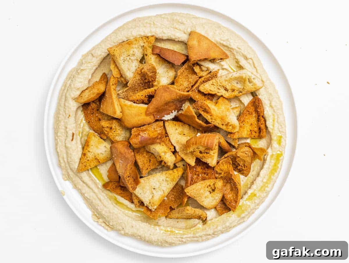 Fatteh with Pita, Hummus, and Creamy Yogurt Bowl 10 hummus with crispy pita chips