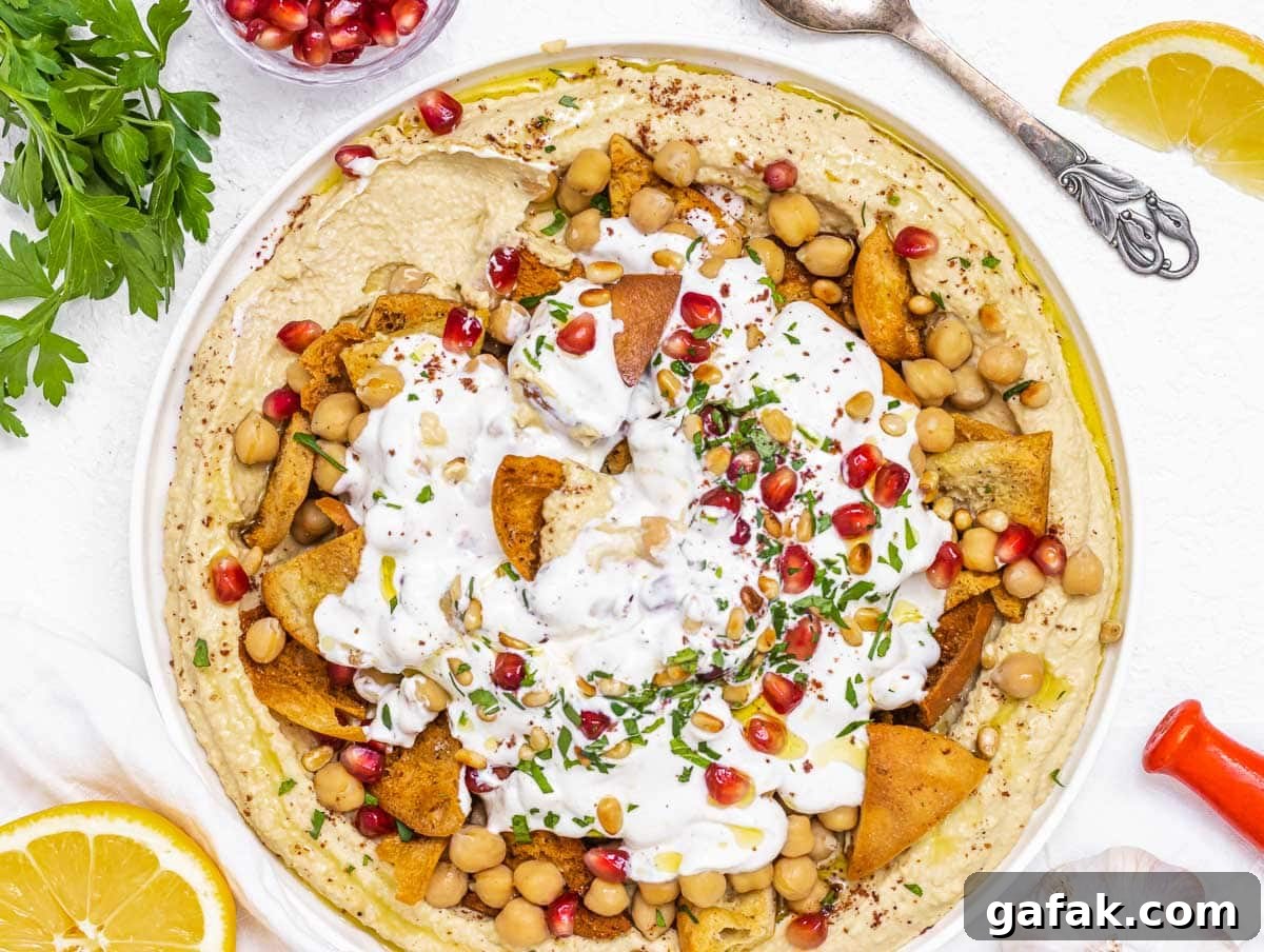 Fatteh with Pita, Hummus, and Creamy Yogurt Bowl 5 Fatteh with lemon and parsley