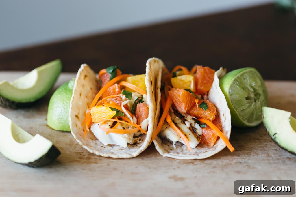 Grilled fish tacos with citrus carrot slaw on cassava flour tortillas. Gluten-free, grain-free and paleo.