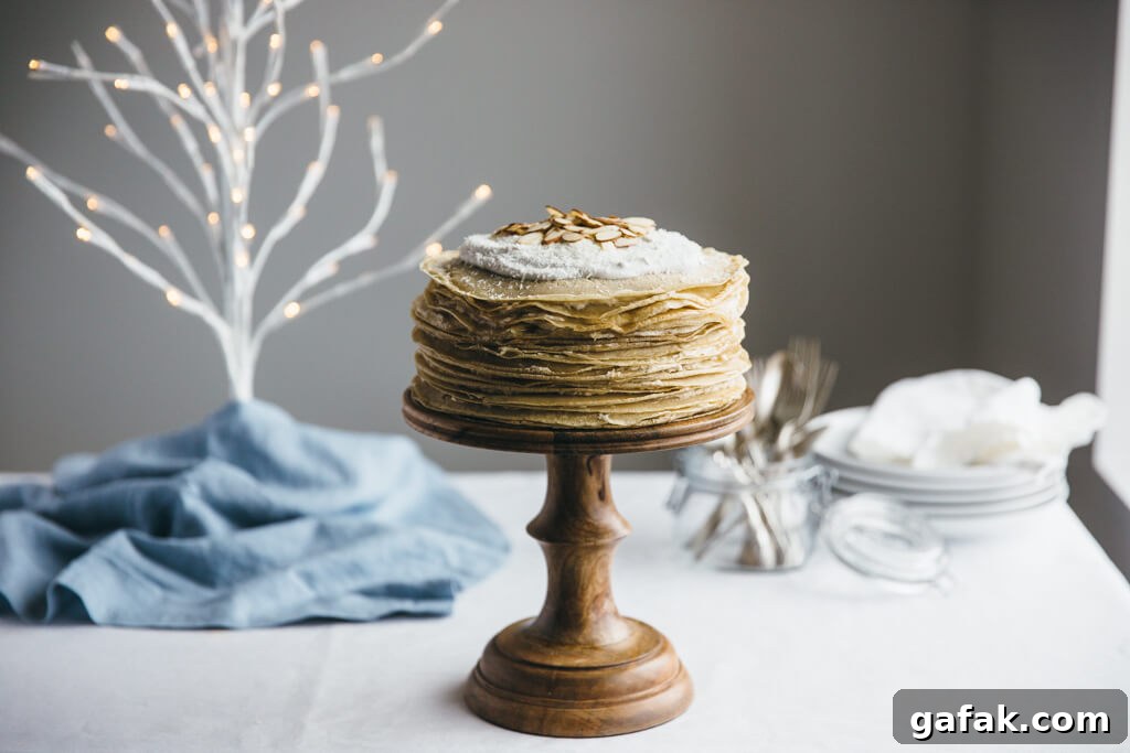 Coconut amaretto crepe cake. It's gluten-free, grain-free and refined sugar free and made with cassava flour crepes. Paleo-friendly.