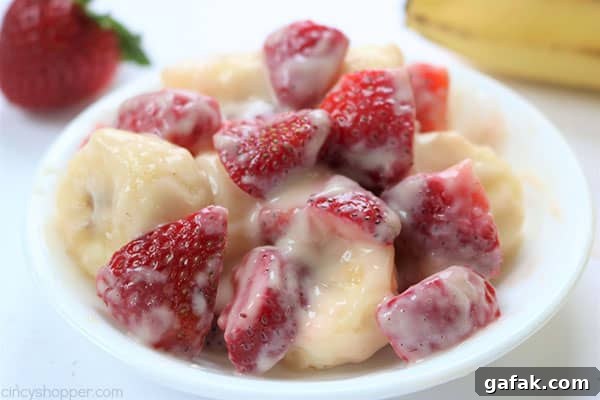 Creamy Strawberry Banana Salad - so super easy to make and makes for a super side dish or dessert for summer potlucks. #strawberries #fruit #salad #sidedish