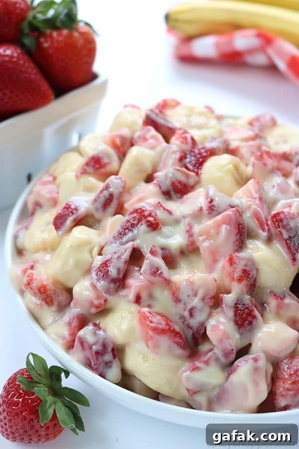 Creamy Strawberry Banana Salad - so super easy to make and makes for a super side dish or dessert for summer potlucks. #strawberries #fruit #salad #sidedish