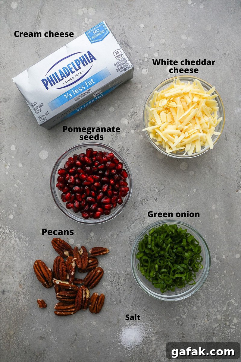 Ingredients used to make a pomegranate white cheddar cheese ball