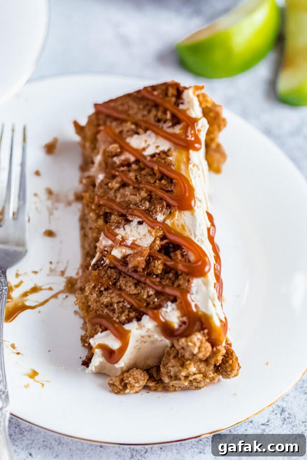 half eaten slice of caramel apple crumble cake on a plate