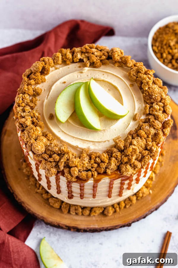top view of apple crumble cake with crumble around the edges and apple slices in the centre 