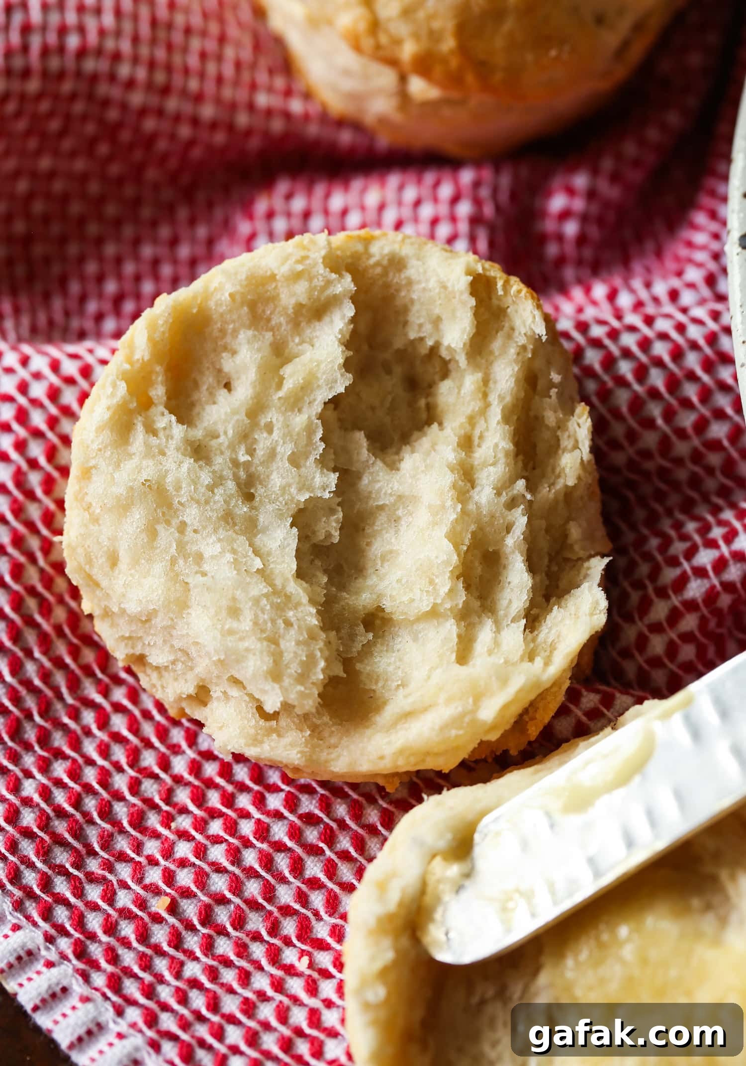 biscuit cut in half on a towel
